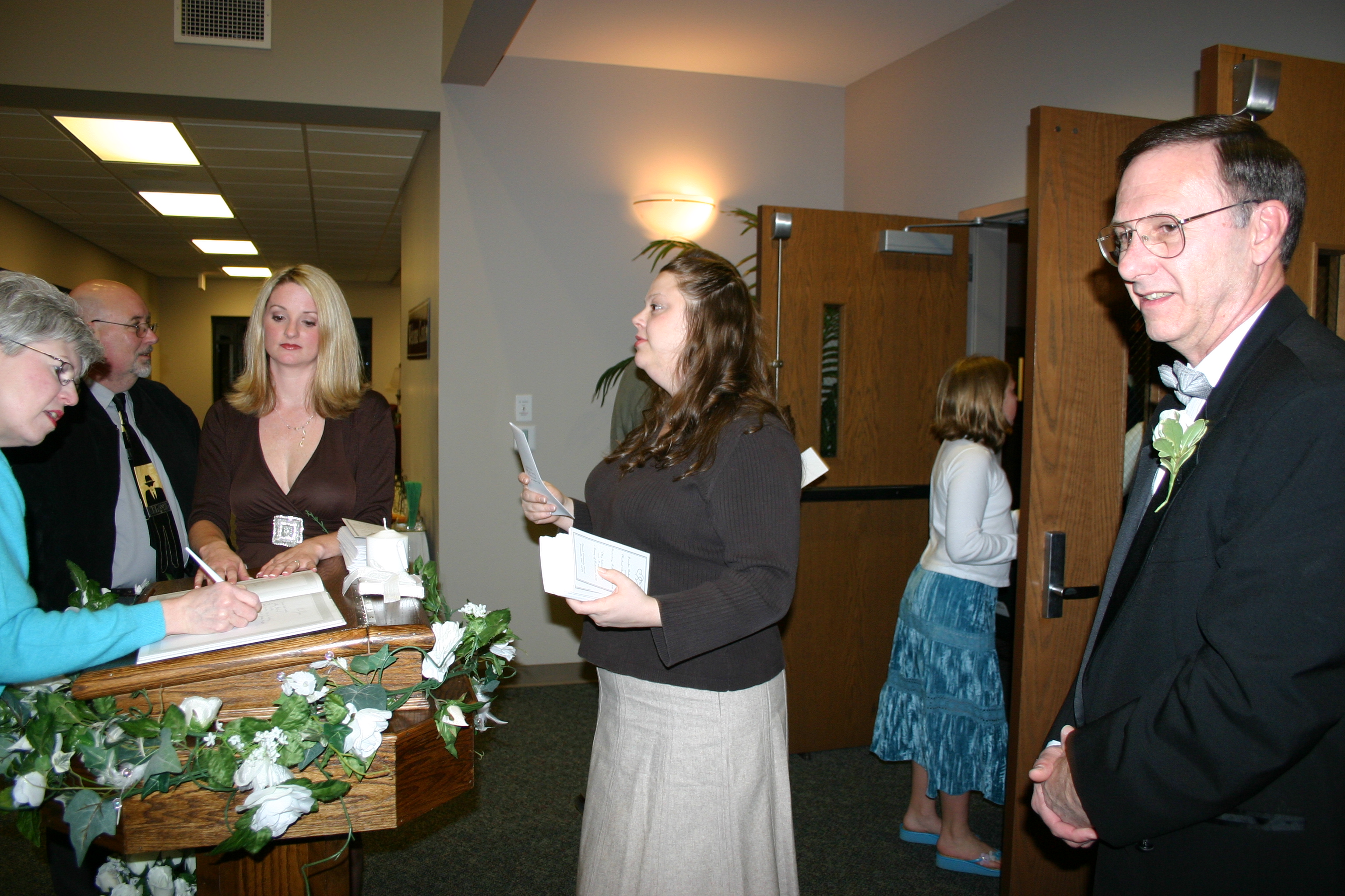 Marie Jolly & Page Graham greeting guests
