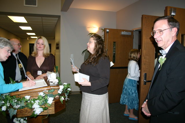 Marie Jolly & Page Graham greeting guests